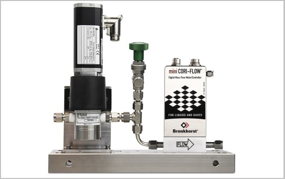 mini CORI-FLOW flow meter combined with a Tuthill pump